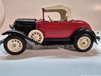 Left side view of die-cast 1931 Ford Model A Roadster showing body colours and wheels