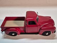 Profile view of red 1950 Chevrolet 3100 1:25 model truck
