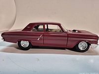 Left side profile of maroon 1964 Ford Fairlane Thunderbolt model