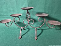 Front view showing five platforms and scroll design