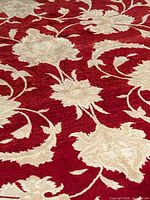 Close-up of red field with ivory floral motifs