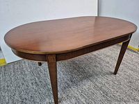 Full view of oval wood dining table