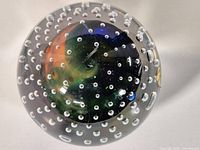 Full view of paperweight showing bubble pattern and central swirl