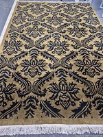 Full view of rug showing complete pattern and fringe