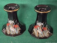 Front view of both Toyo porcelain candle holders showing iris design and gold trim