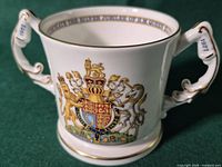 Front view showing royal coat of arms and overall condition