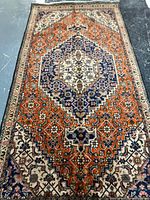 Full view of Persian Tabriz wool rug showing design and condition