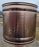 Side view of hammered antique brass planter