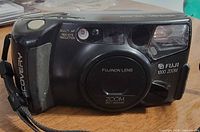 Front view of Fujifilm Discovery 1000 Zoom camera showing lens, flash, controls