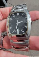 Front view of watch showing dial, case shape and condition