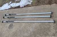 Three cargo bars laid out full length