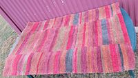 Full view of striped wool rug on table