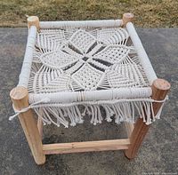 angled view showing full stool, wood frame and macramé seat
