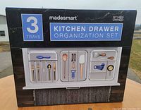 Front of boxed Madesmart Kitchen Drawer Organization Set showing three included trays