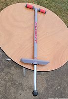 Full view of NSG Flight pogo stick upright on ground