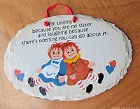 Front of slate showing artwork, quote, ribbon