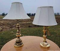 Front view of both brass lamps with shades attached