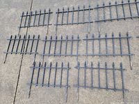 All ten interlocking fence panels laid out