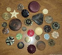 Overhead view of entire assortment of buttons on tabletop