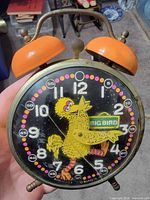 Front view showing Big Bird dial, numerals, crack in lens