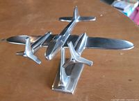 oblique front view showing twin-engine airplane form and propellers