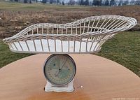 Full view of scale with wicker cradle attached