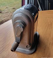 Front view showing adjustable dial and crank handle