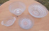 Top view of all four clear glass bowls displaying patterns and relative sizes