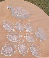 full set on tabletop showing large bowl and ten small dishes