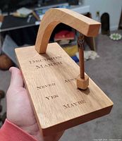 top view showing engraved text and suspended pointer