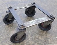 Perspective view of steel dolly showing frame and all four wheels