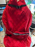 Red quilted dog jacket with adjustable straps