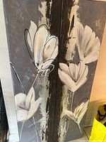 Front view of both canvas panels showing lily artwork