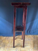 Full view of tall two-tier wooden plant stand