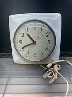 Westinghouse white plastic square electric wall clock with power cord
