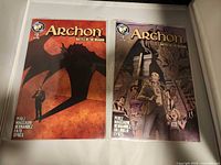 Front view of both Archon issues #1 and #2 in sleeves
