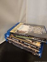 Stacked view of five Blu-ray cases showing spines
