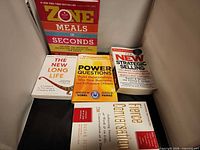 All five books front covers visible