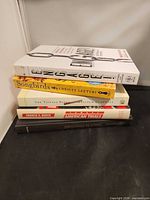 Spine view of the five books stacked