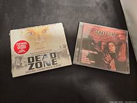 Both CDs side by side showing covers