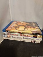 Stacked view showing A Single Man on top and spines of three other titles