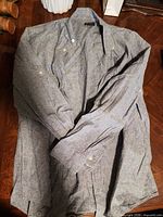 Full view of the Haggar button-up shirt laid flat showing overall style