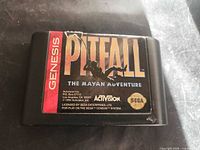 Front of Pitfall Sega Genesis cartridge showing label wear