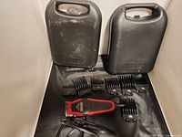 Two Wahl branded plastic cases, trimmer, eight guide combs, combs partially visible