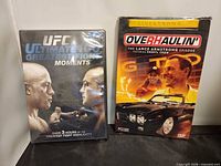 Front view of both sealed DVDs showing titles and cover artwork