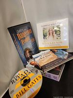 Group of all five audio titles standing and stacked