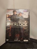 Front of sealed Sherlock Season One DVD case showing shrink wrap and cover art