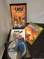 Group shot showing all four game cases and discs