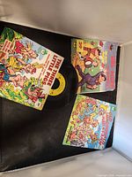 Front view of all three picture sleeves and one visible vinyl record