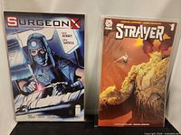 Front covers of Strayer #1 and Surgeon X comics in bags
